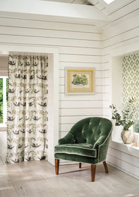 Nina Campbell Athena Elsie Green Fabric as a bling with Peggy Fabric as a curtain and a mabel chair in gabrielle fabric in green in a room