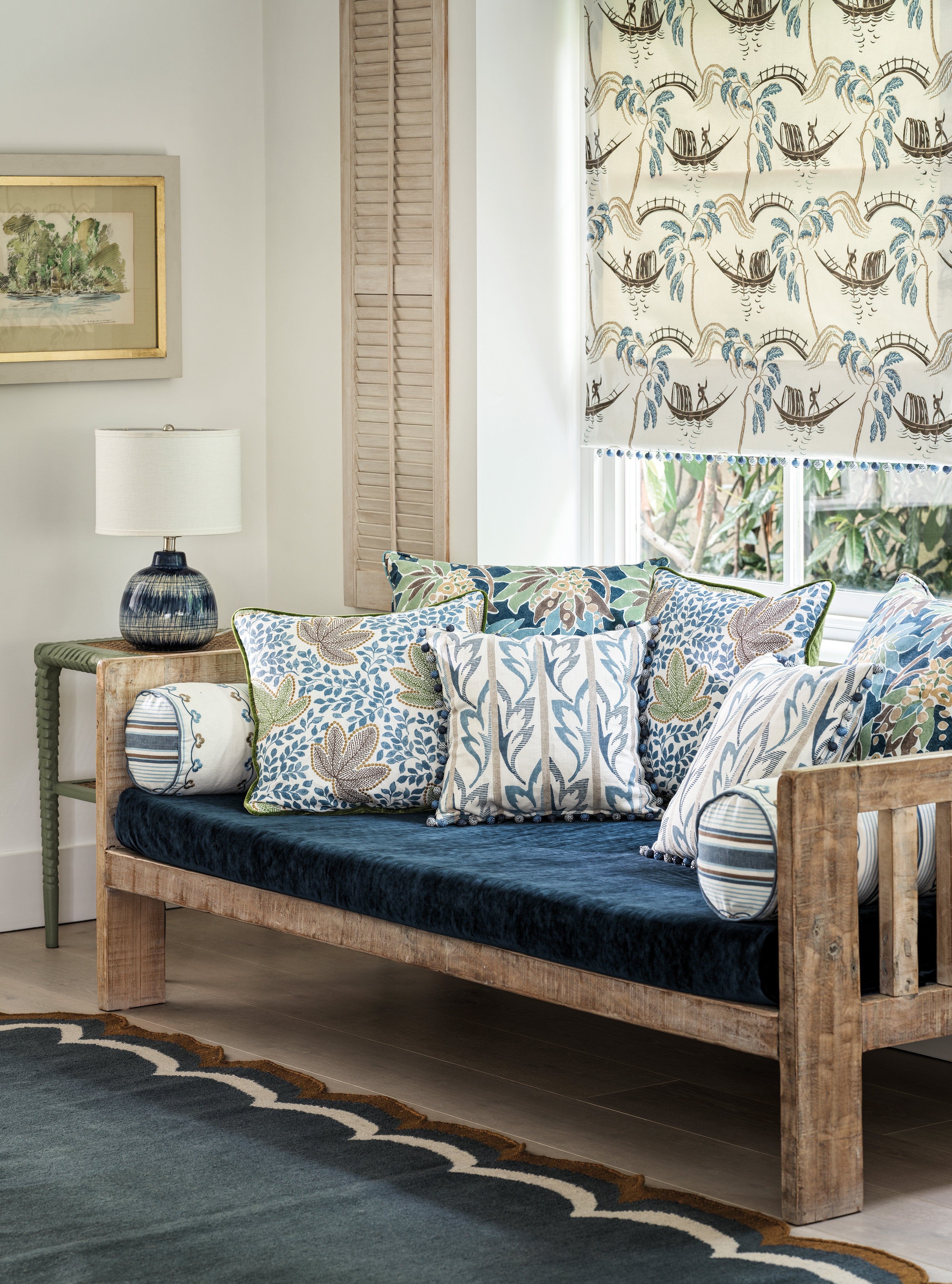 Nina Campbell Athena Fabric collection on cushions and a blind as well as gabrielle fabric on a sofa cushion and batik table lamp
