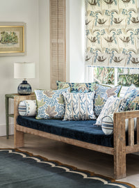 Nina Campbell Athena Fabric collection on cushions and a blind as well as gabrielle fabric on a sofa cushion and batik table lamp