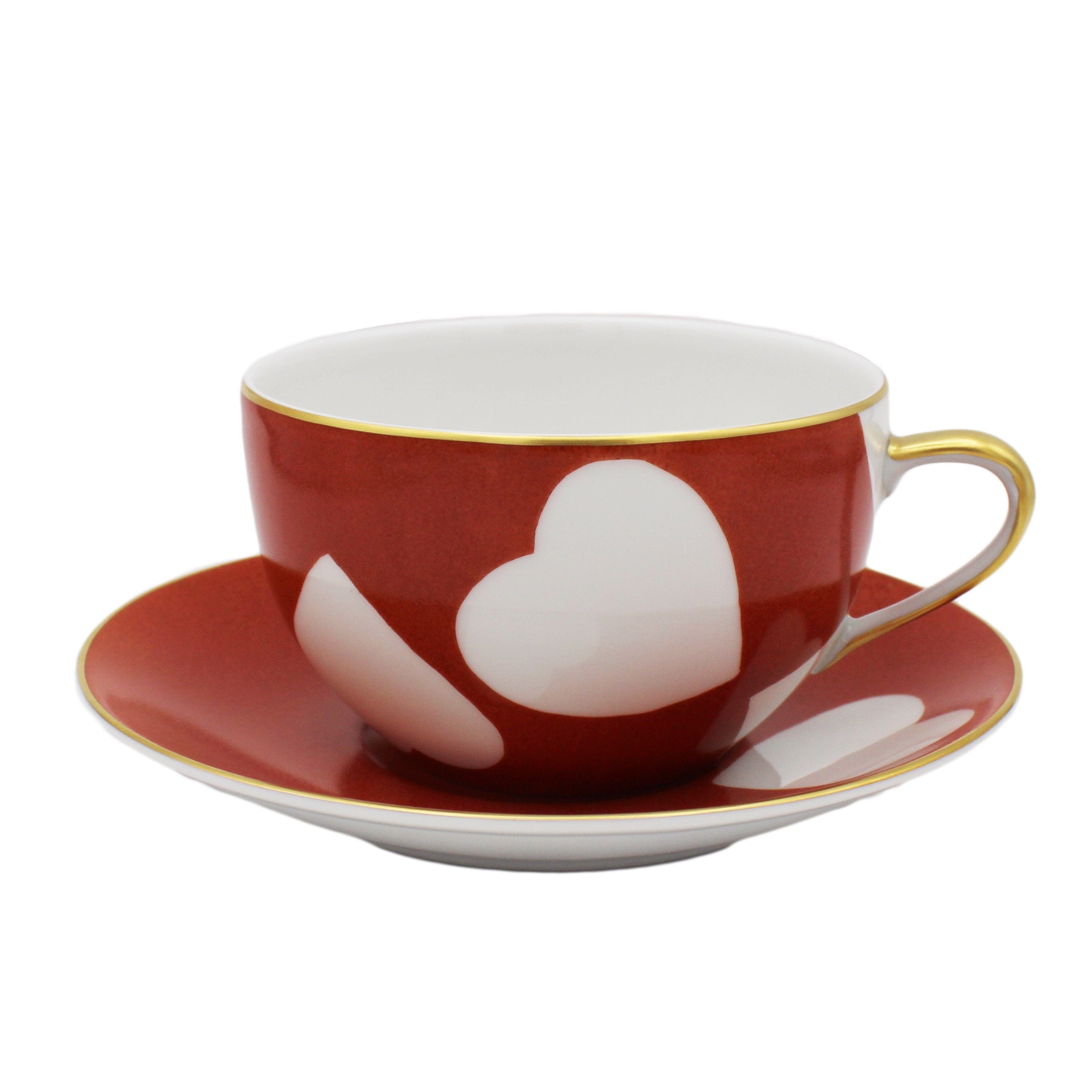 Nina Campbell Heart Breakfast cup and saucer in Coq de Roche colour on white background. 