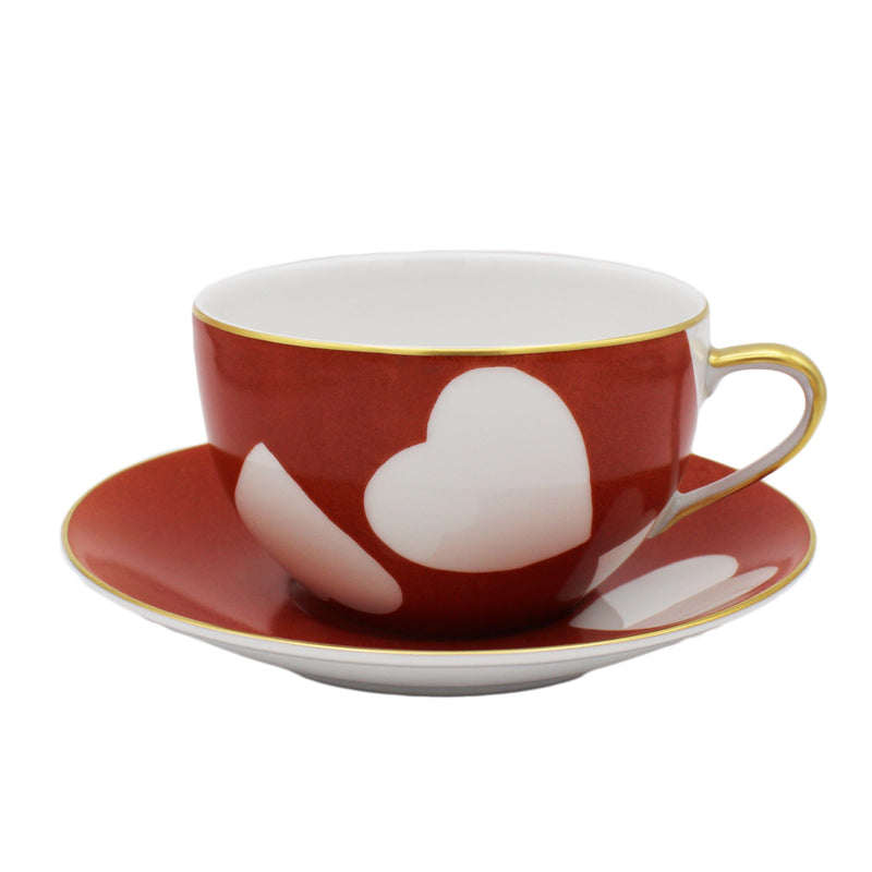 Nina Campbell Heart Breakfast cup and saucer in Coq de Roche colour on white background. 