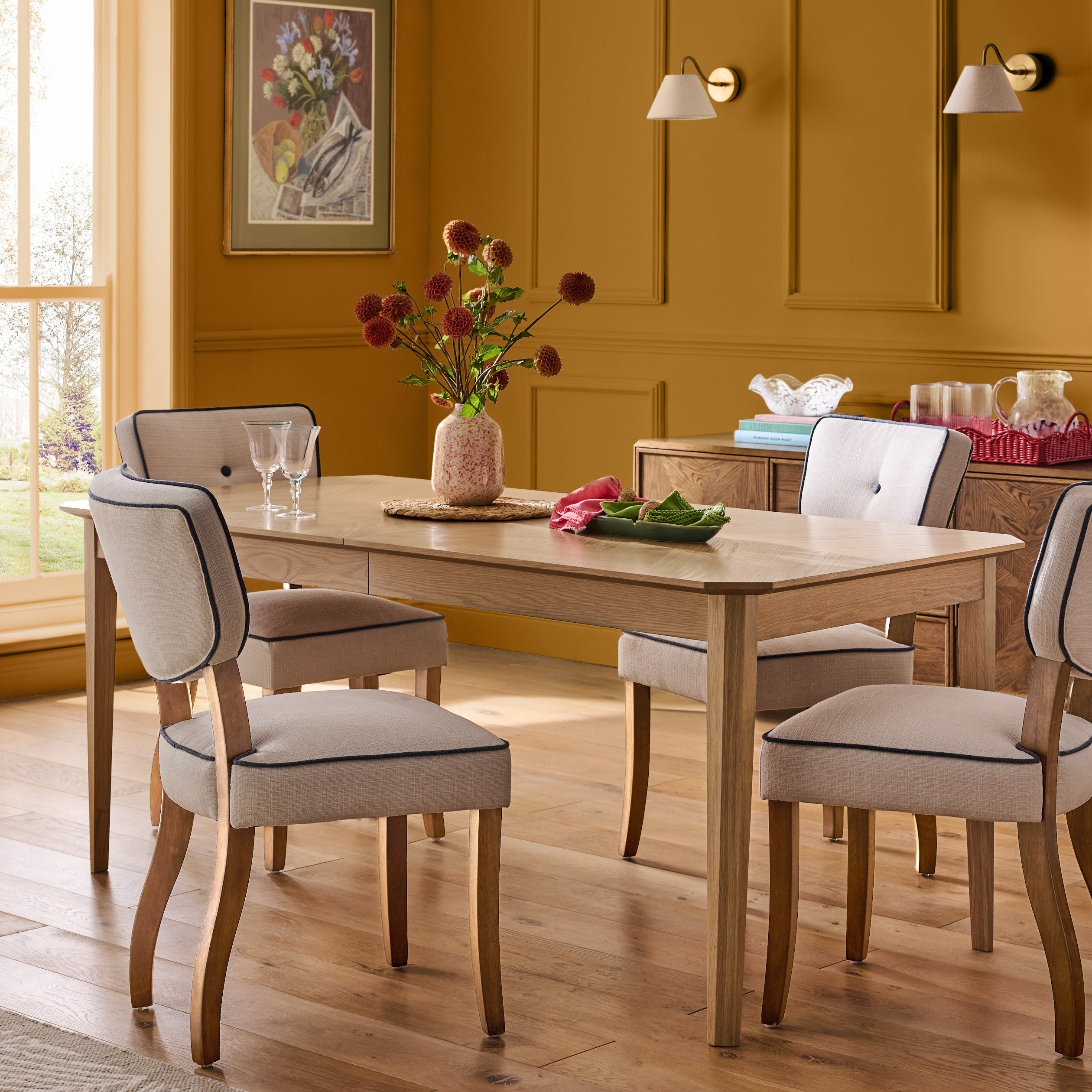 Nina Campbell Light Oak Tedworth 6 to 8 Seater Extending Dining Table in styled setting 