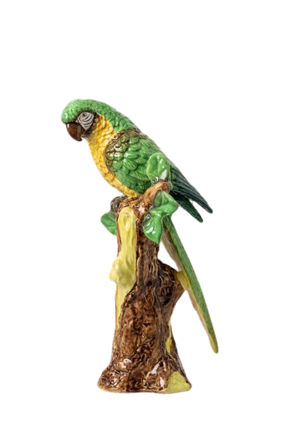 Nina Campbell ceramic parrot perched on branch in greens and yellows