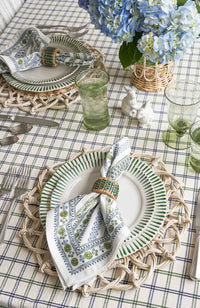 Nina Campbell green Sitio Stripe dinner plate on it styled