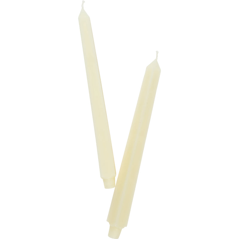 Cream candles on white background 