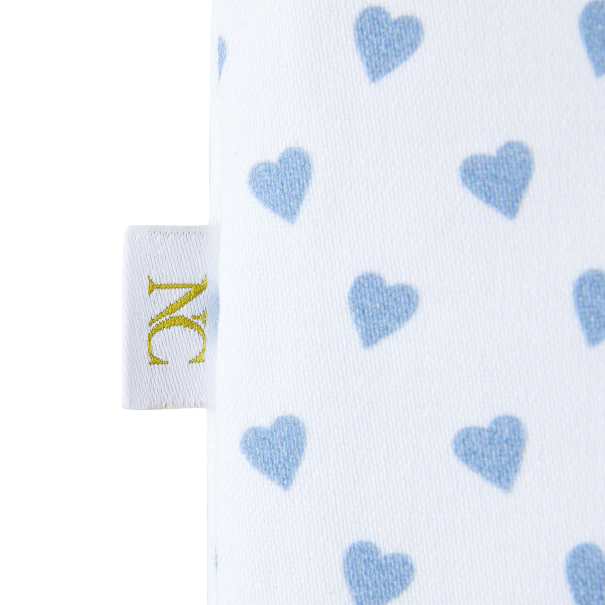 Nina Campbell tissue box cover in fabric with blue hearts against a white background tag close-up