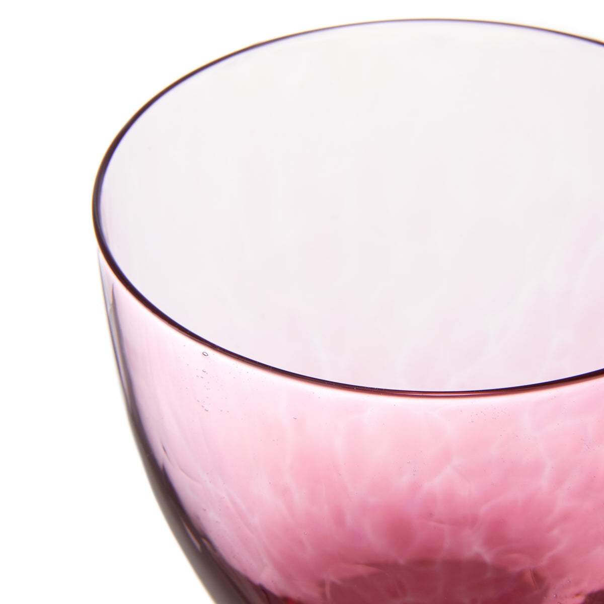 Nina Campbell Jewel Large Wine Glass Pink Sapphire against a white background closeup rim